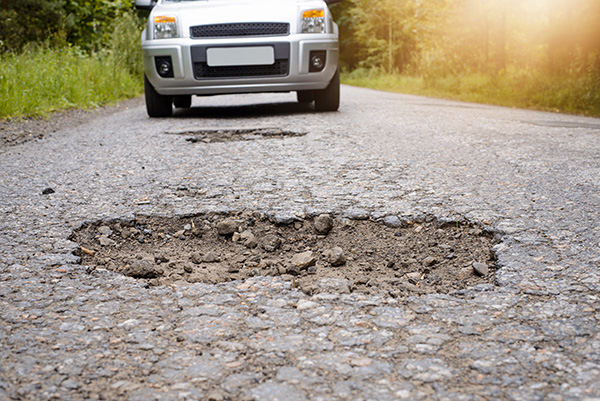 Why Your Steering Wheel Vibrates After Hitting a Pothole